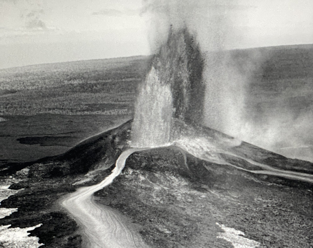 Archive photo of woman golfing into Kilauea crater.