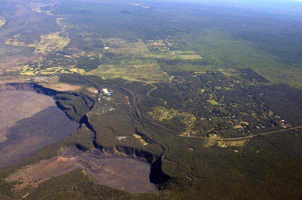 Archive photo of woman golfing into Kilauea crater.