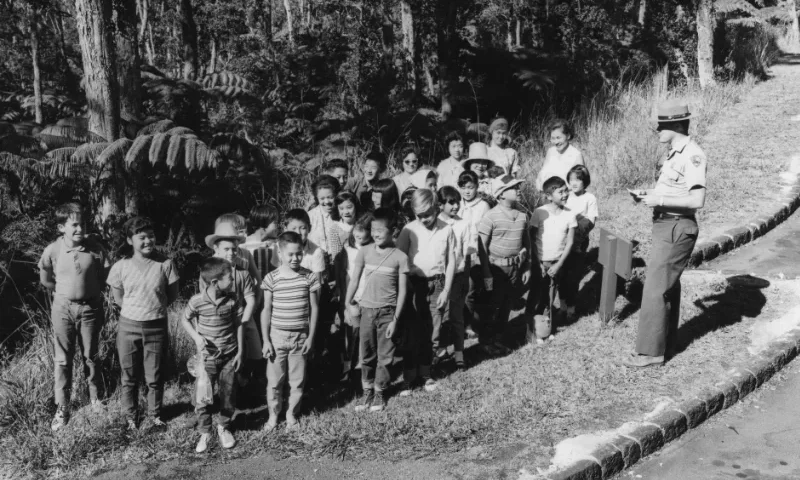 Student class visit with park ranger in volcano.